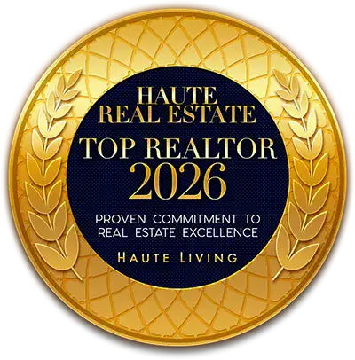 Gold award badge with laurel border reading 'Haute Real Estate Top Realtor 2026'