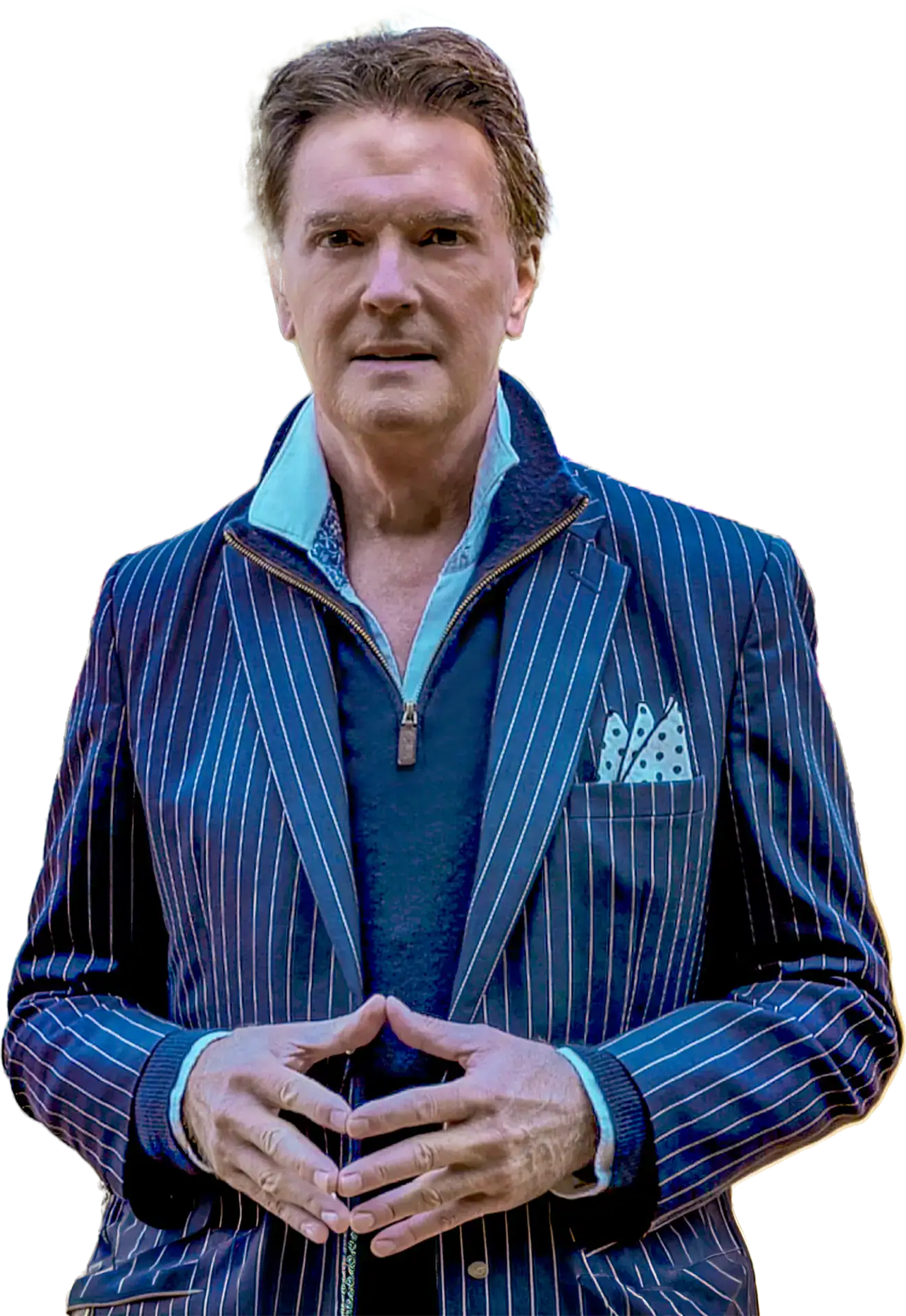 Greg Gunter in a blue pinstripe blazer with his hands together