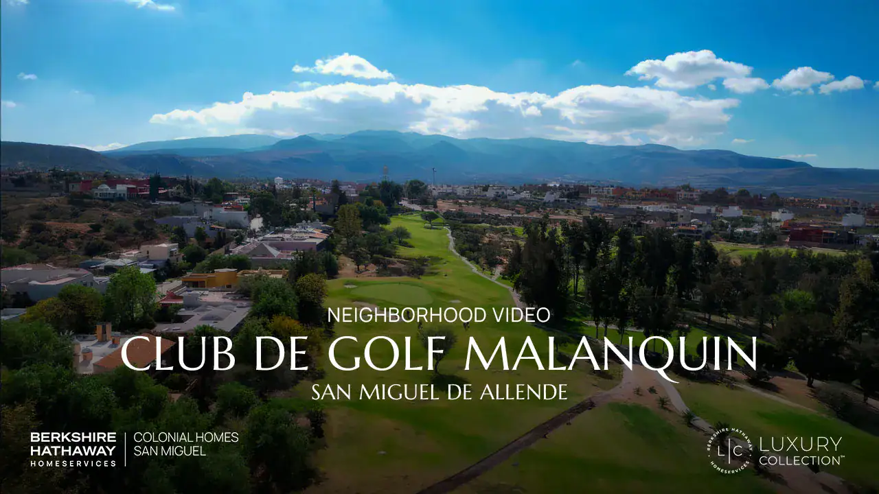 Aerial view of a green golf course with trees and a town in the distance; large white overlay text reads 'Neighborhood Video' and 'Club de Golf Malanquín, San Miguel de Allende'.