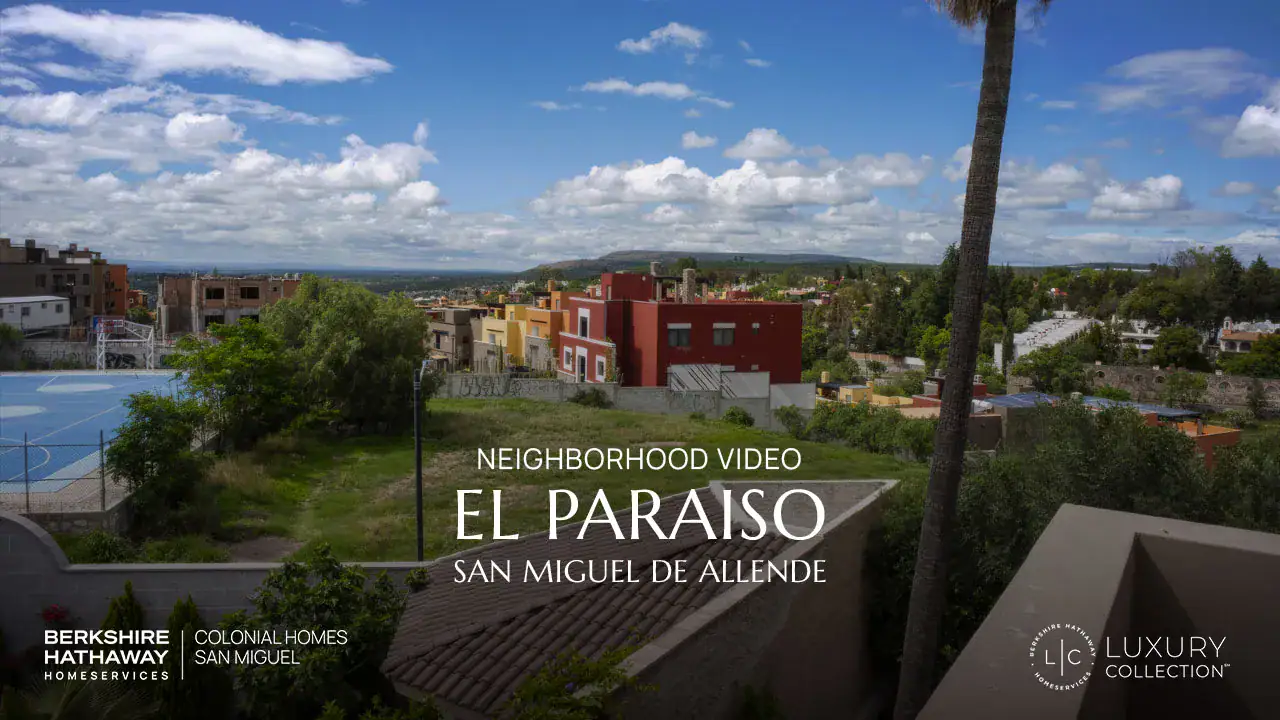 Video cover image: colorful San Miguel de Allende neighborhood under a blue sky, with overlay text reading 'Neighborhood Video El Paraiso San Miguel de Allende' and logos for Berkshire Hathaway Homeservices Luxe Collection at the bottom left and right.
