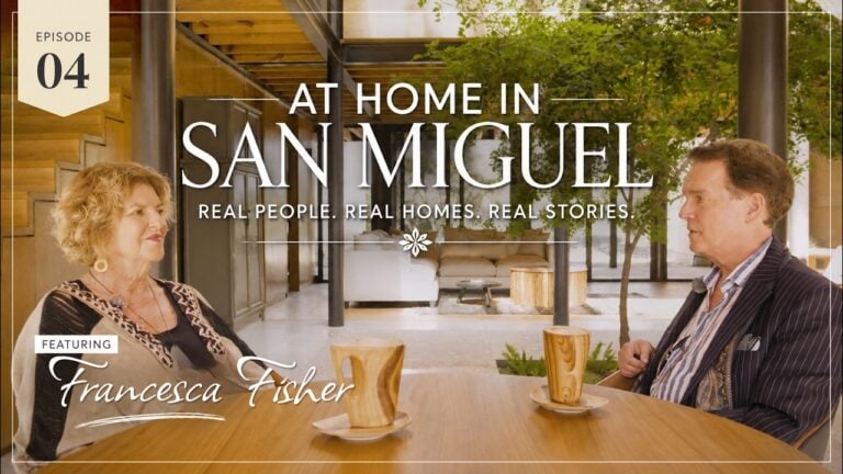 Episode 04 banner: two hosts seated at a wooden table in a modern open interior, with the title 'At Home in San Miguel' and 'Francesca Fisher' featured.