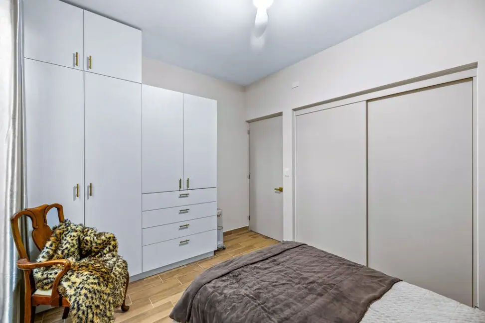 Casa Angel, bedroom with built-in white wardrobes, San Miguel de Allende
