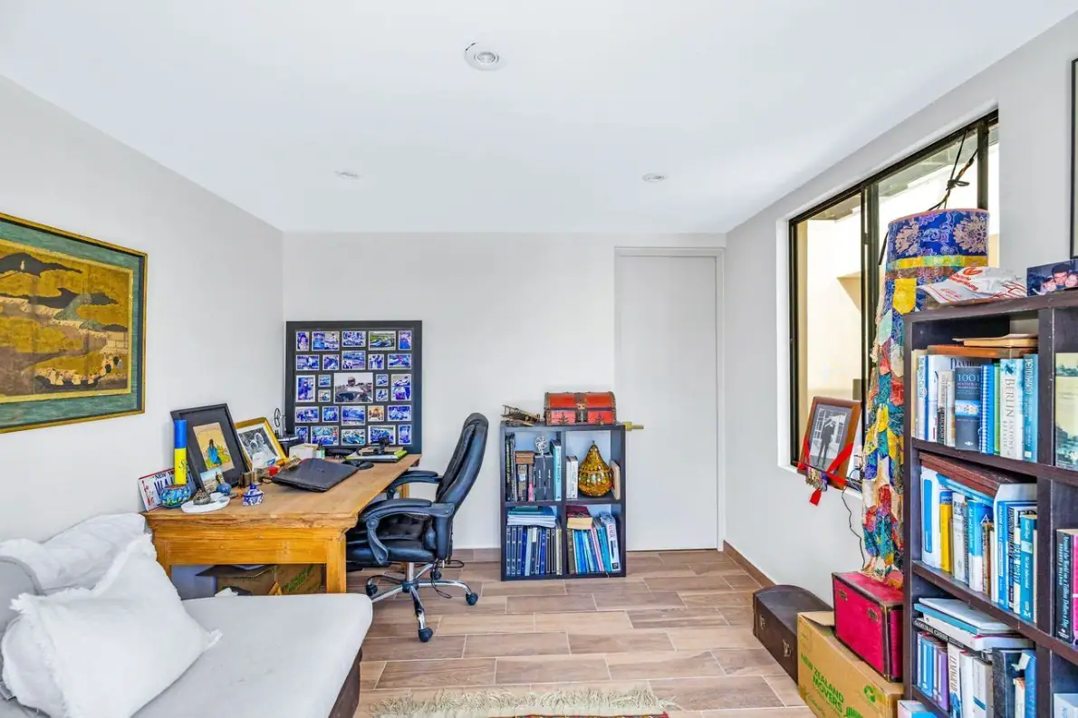 Casas Angel & Angelito, office with a wooden desk and a bookshelf, San Miguel de Allende