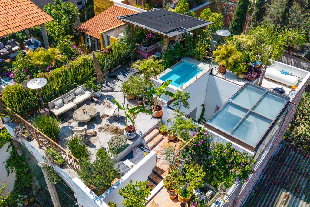 Casa Clae, aerial view of the rooftop terrace with a plunge pool, skylights and lounge areas, San Miguel de Allende