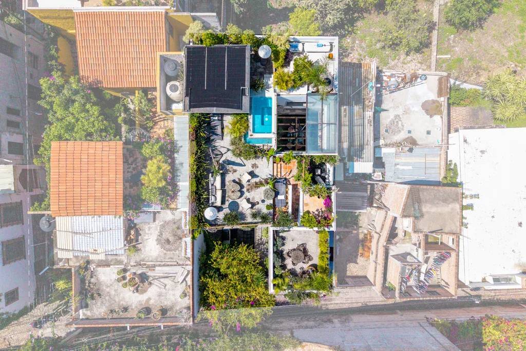 Casa Clae, top-down aerial view of the roof terrace with a plunge pool and skylights, San Miguel de Allende