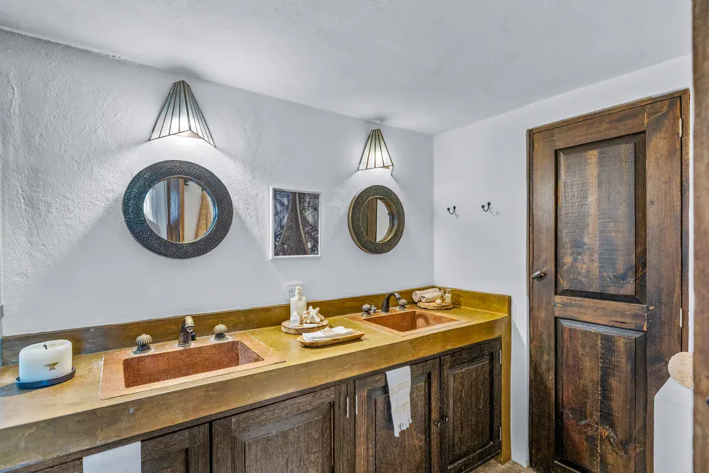 Casa Clae, bathroom with double copper sinks and round mirrors, San Miguel de Allende