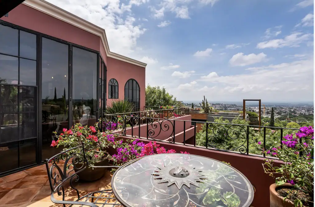 Casa del Arroyo, terrace with a round mosaic table and views of the valley, San Miguel de Allende