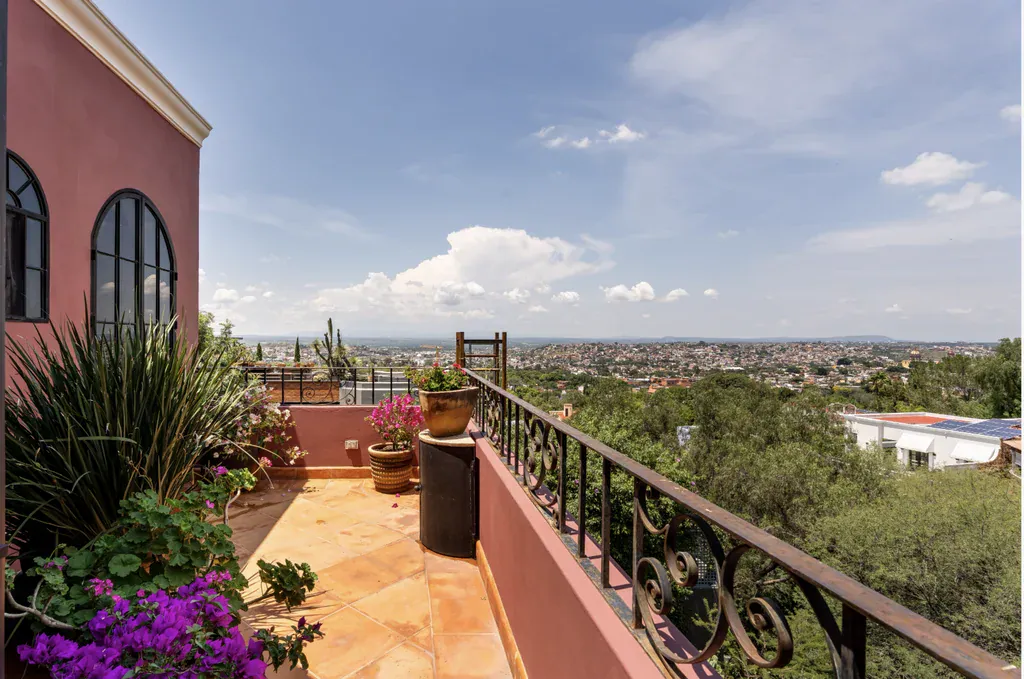 Casa del Arroyo, balcony with a wrought-iron railing and wide views of the town, San Miguel de Allende