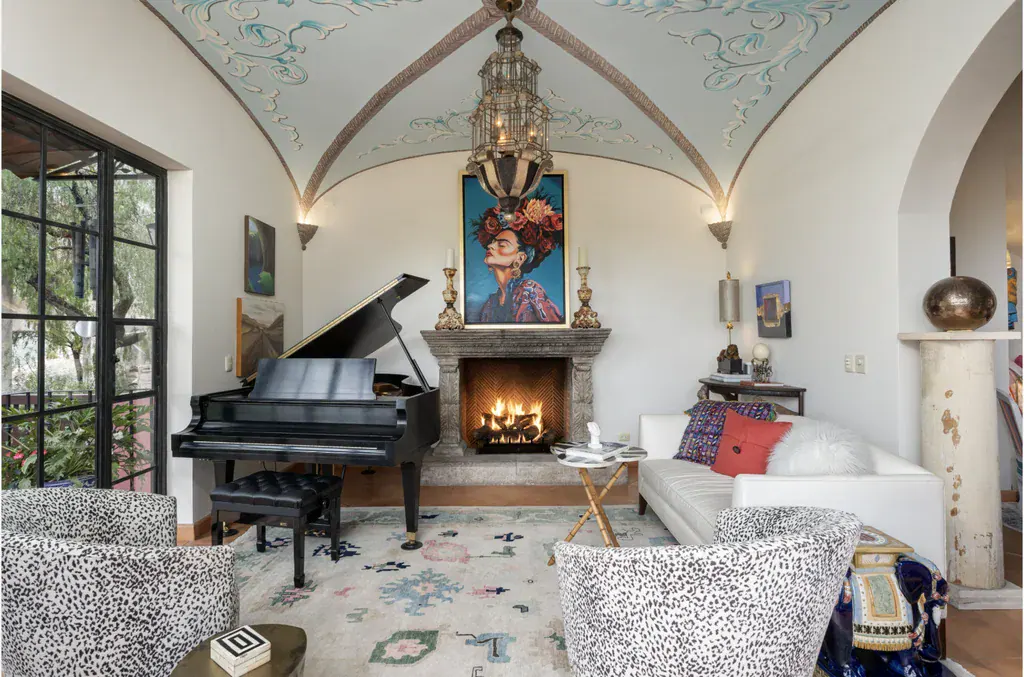 Casa del Arroyo, sitting room with a grand piano, fireplace and painted vaulted ceiling, San Miguel de Allende