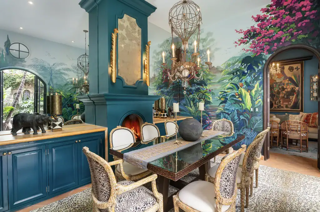 Casa del Arroyo, dining room with a hand-painted jungle mural and a blue fireplace, San Miguel de Allende