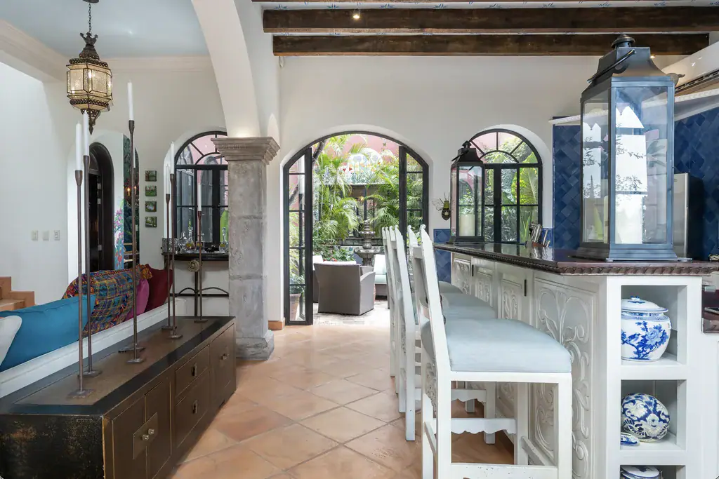 Casa del Arroyo, kitchen counter and bar stools opening to the courtyard, San Miguel de Allende