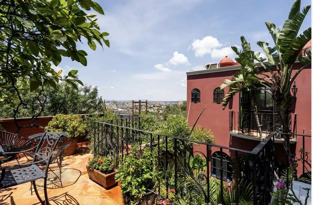 Casa del Arroyo, balcony terrace with wrought-iron furniture and views over the city, San Miguel de Allende
