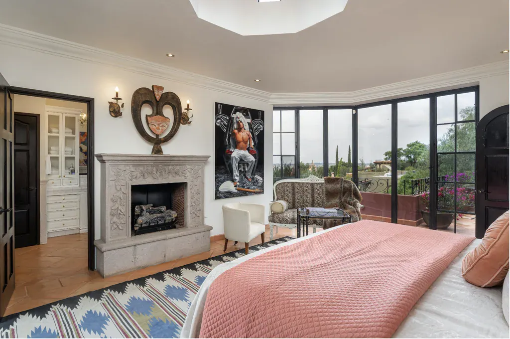 Casa del Arroyo, primary bedroom with a stone fireplace and an octagonal skylight, San Miguel de Allende