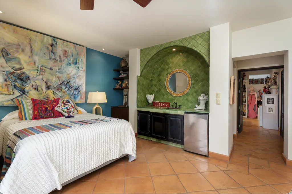 Casa del Arroyo, bedroom with a blue accent wall and a green tiled wet bar, San Miguel de Allende