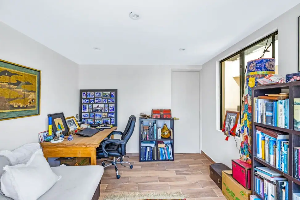 Casa Angel, home office with a wooden desk, bookshelves and a daybed, San Miguel de Allende