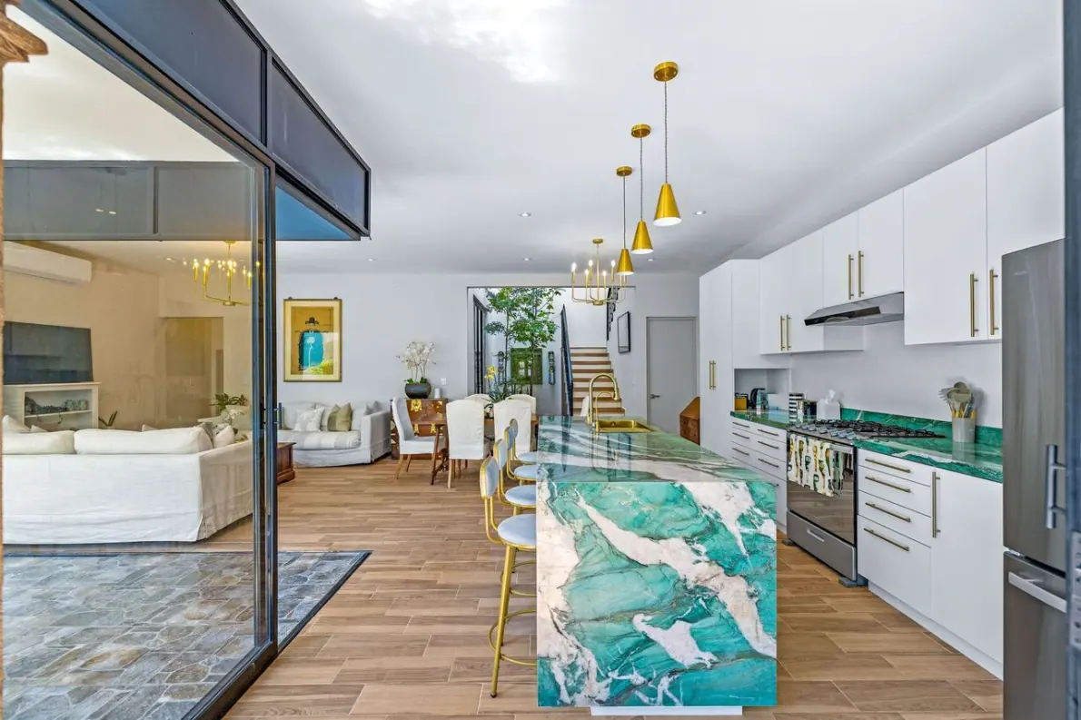 Casas Angel & Angelito, open living and kitchen area with a turquoise marble island, San Miguel de Allende