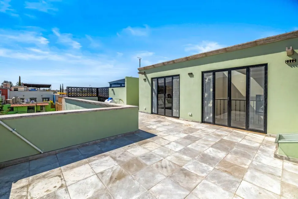 Casa Angel, roof terrace with large glass doors into the upper level, San Miguel de Allende