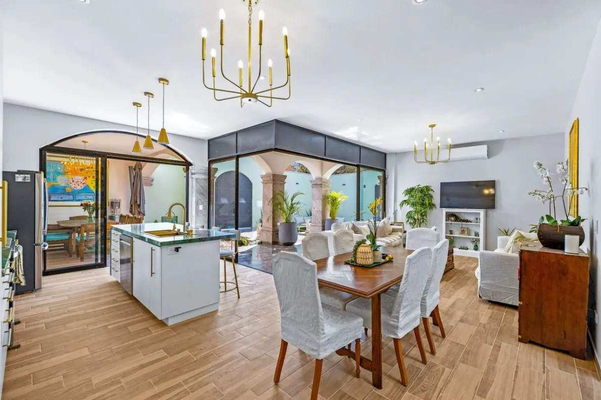 Casas Angel & Angelito, open kitchen, dining and living area with a gold chandelier, San Miguel de Allende