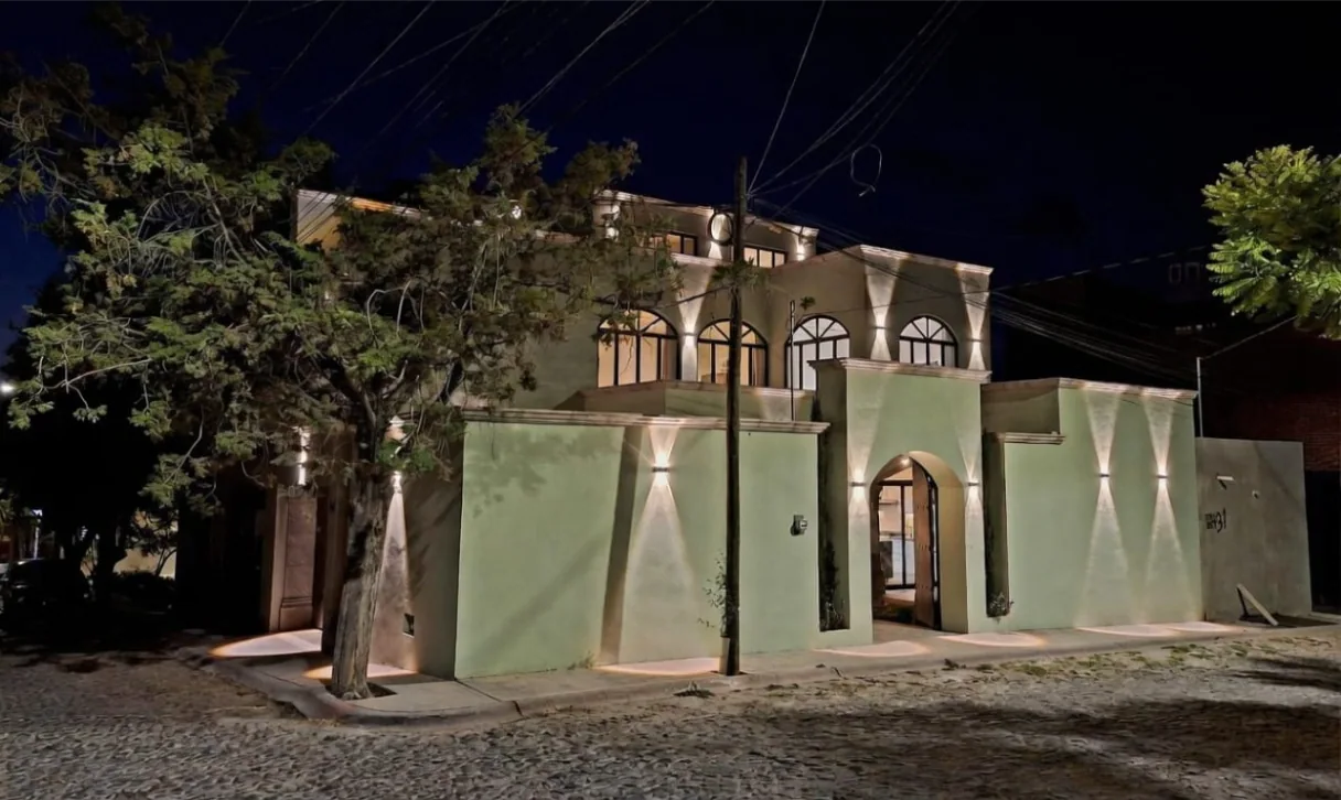 Casa Angel, exterior at night lit by wall lights, San Miguel de Allende