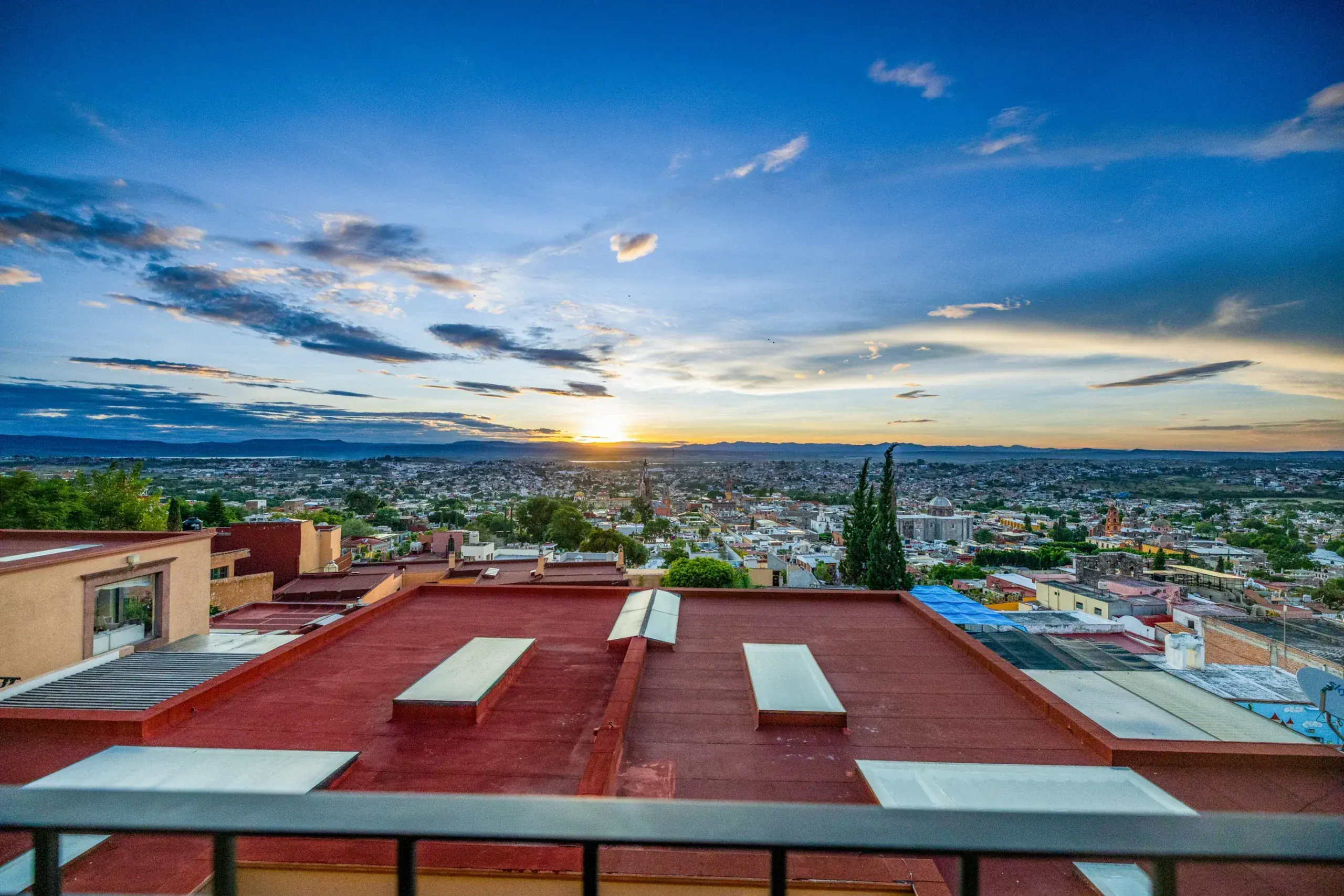 Casa Romana, sunset over the city seen from the balcony, San Miguel de Allende