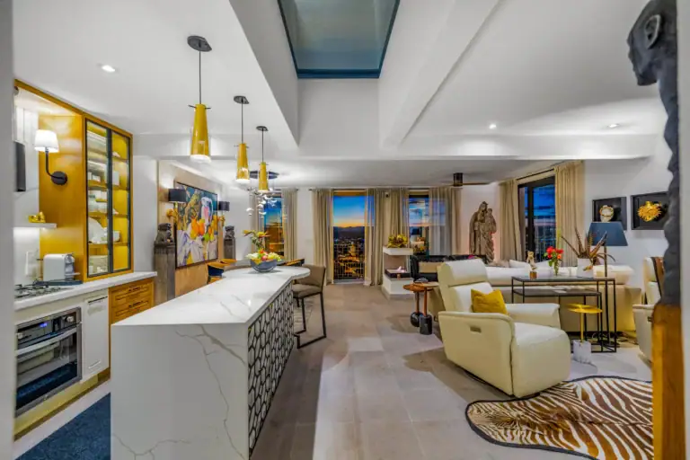 Casa Romana, great room with a skylight, a marble island and city views at dusk, San Miguel de Allende