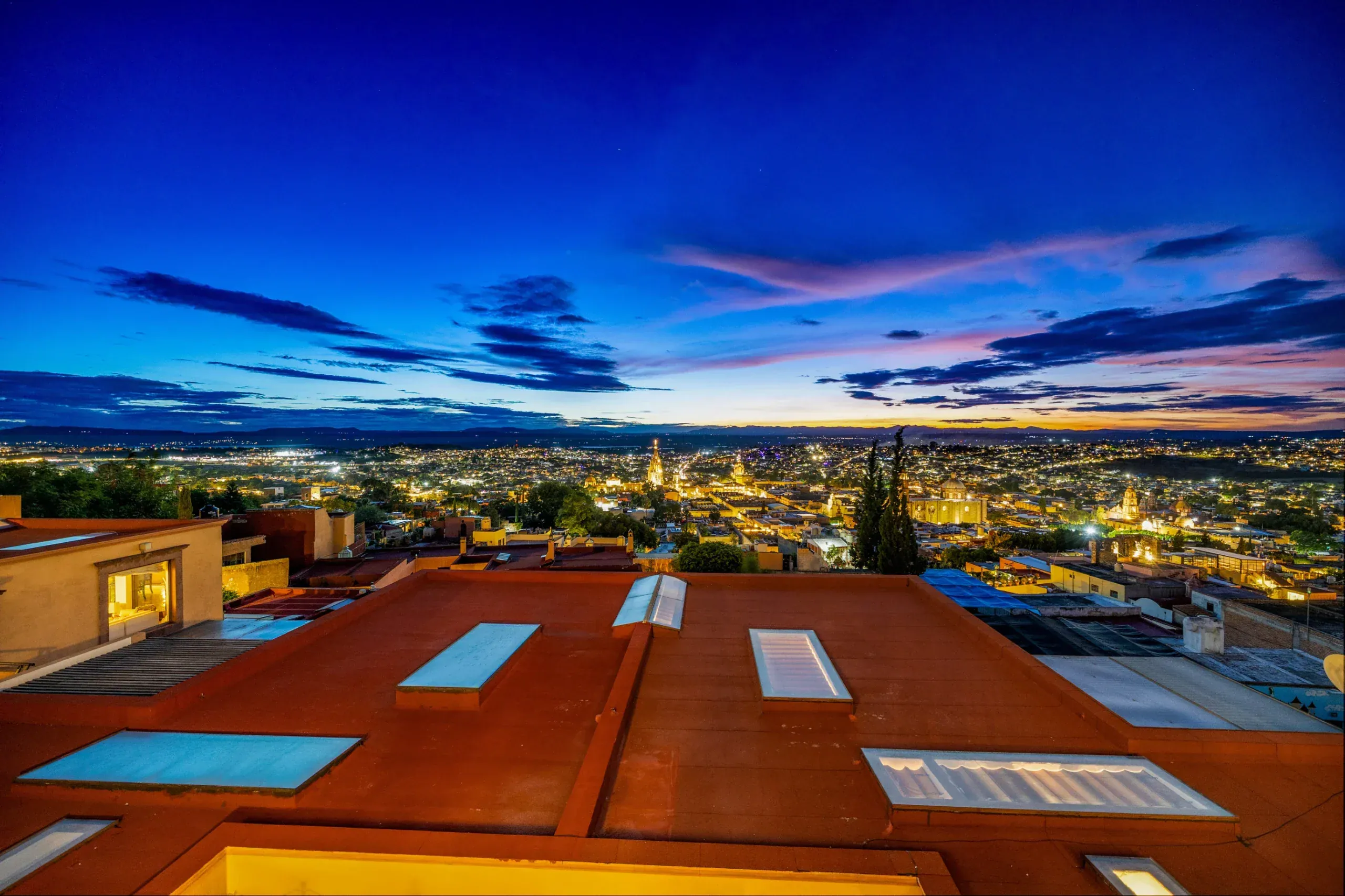 Casa Romana, city lights at dusk seen from the terrace, San Miguel de Allende