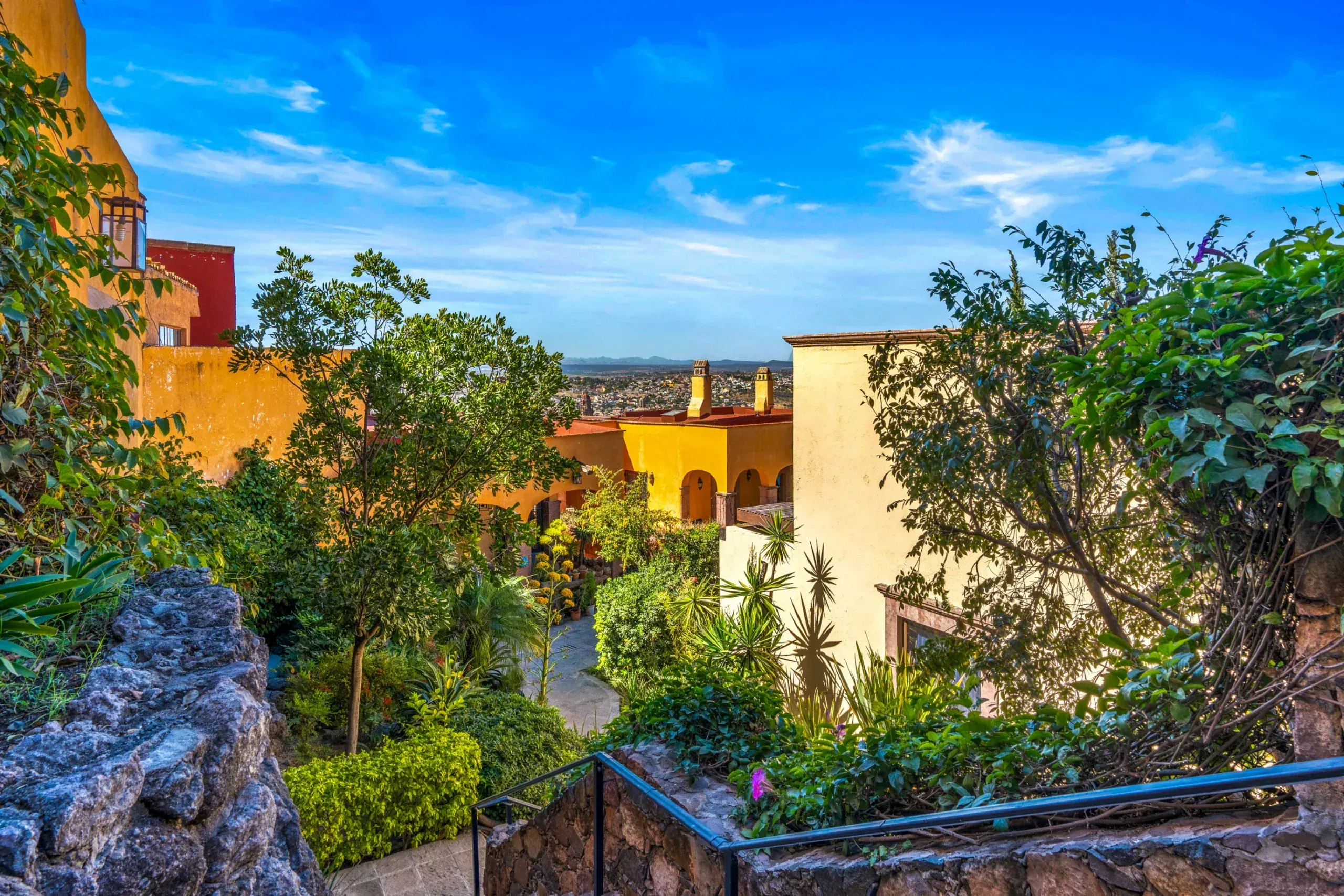 Casa Romana, landscaped gardens of the complex with stairs and tropical plants, San Miguel de Allende