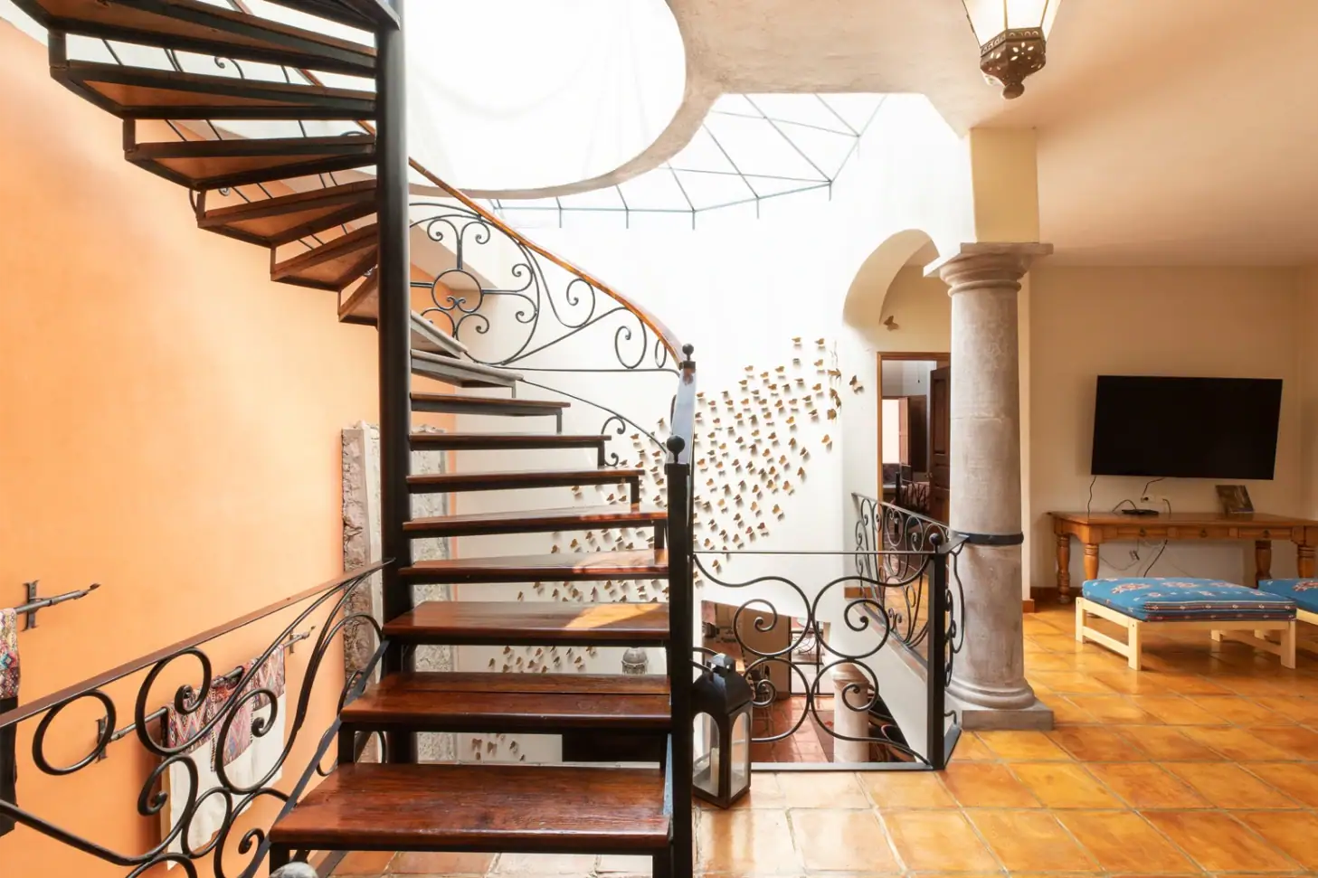 Casa Brillante, wrought-iron spiral staircase and sitting area, San Miguel de Allende