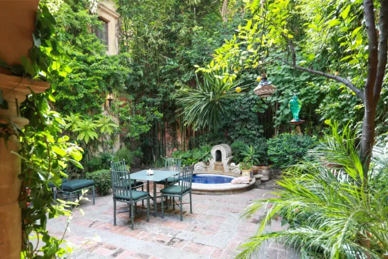 Casa Privada Baeza, courtyard garden with a small fountain pool and seating, San Miguel de Allende