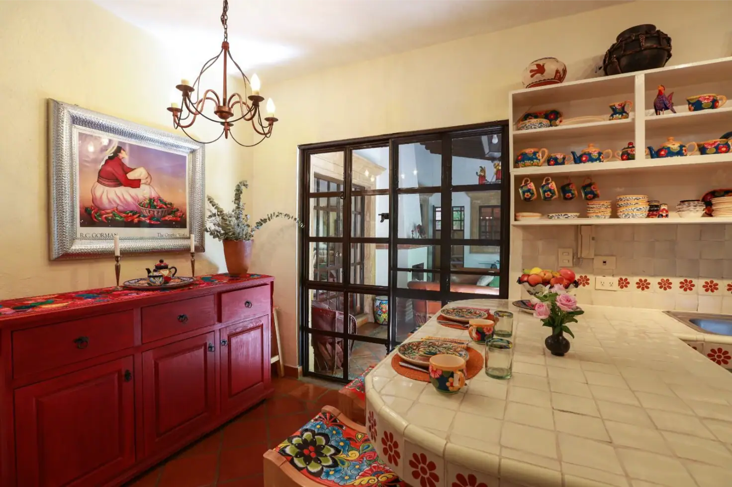 Casa Privada Baeza, kitchen with red cabinets and a tiled island, San Miguel de Allende