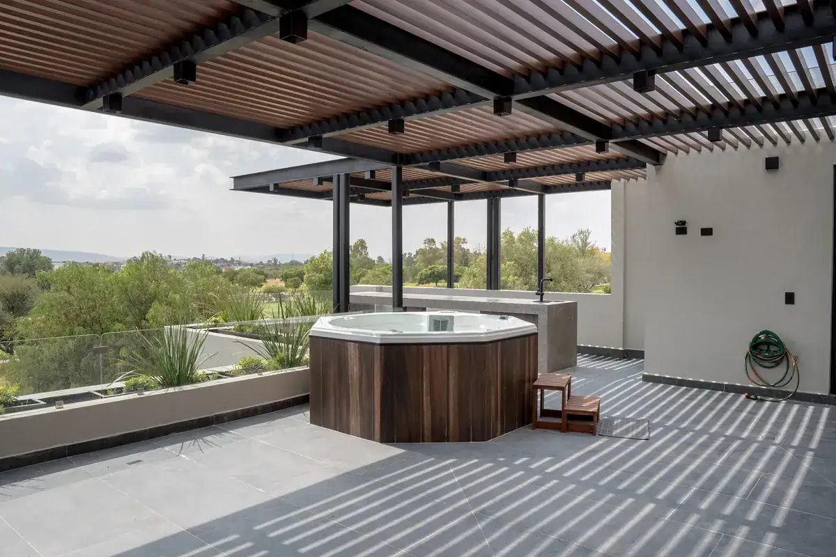 Bright House, rooftop terrace with a wood pergola and an octagonal jacuzzi overlooking the golf course, San Miguel de Allende