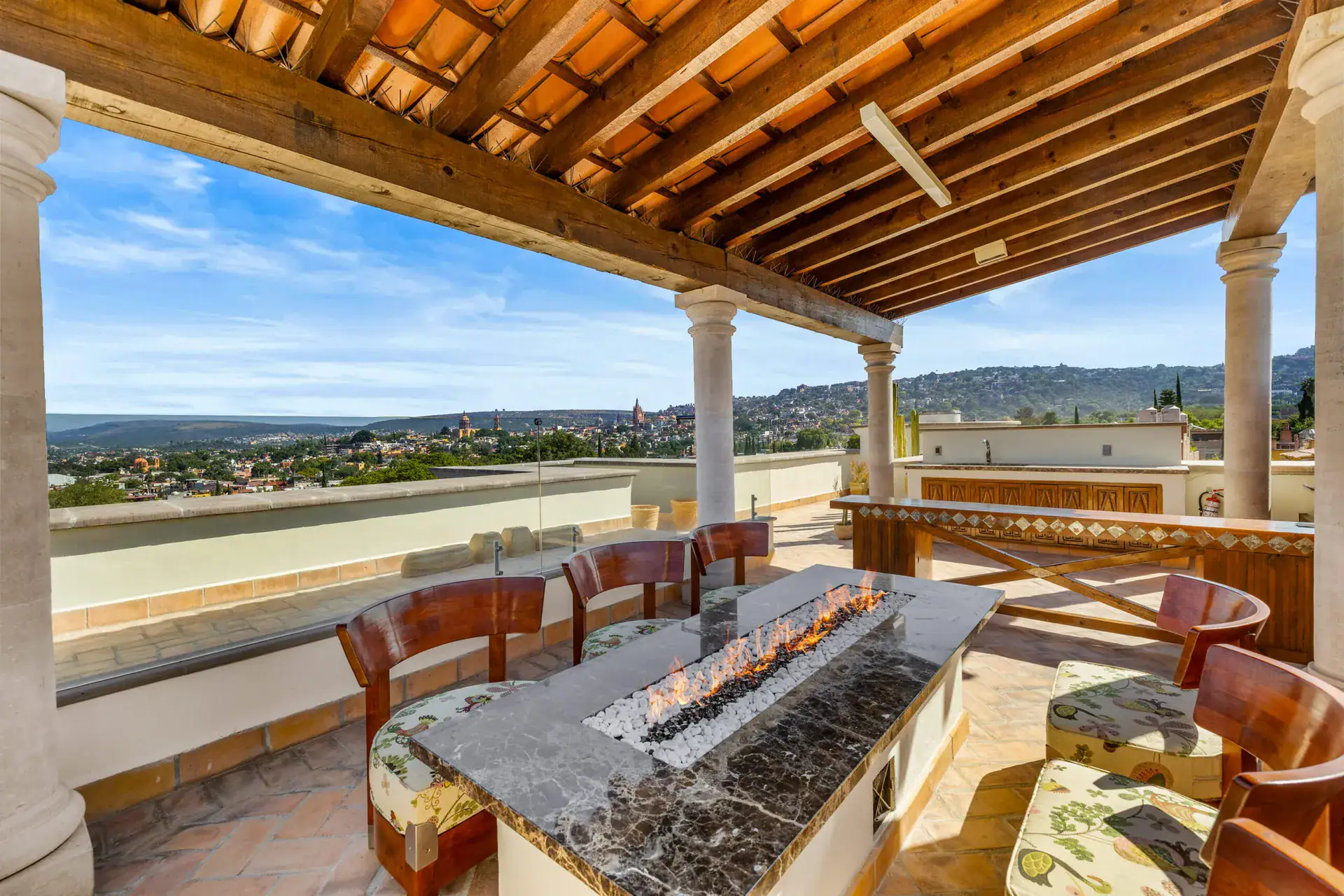 Casa 28 de Abril Norte, rooftop terrace with a tile roof, a fire-table with seating and a view of the town, San Miguel de Allende