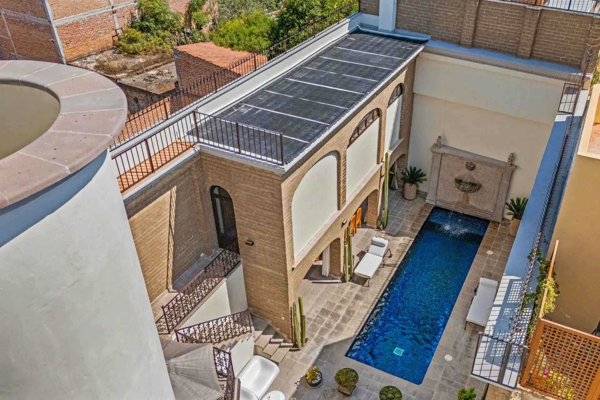 Casa 28 de Abril Norte, aerial view of the courtyard pool and the covered walkway beside the house, San Miguel de Allende