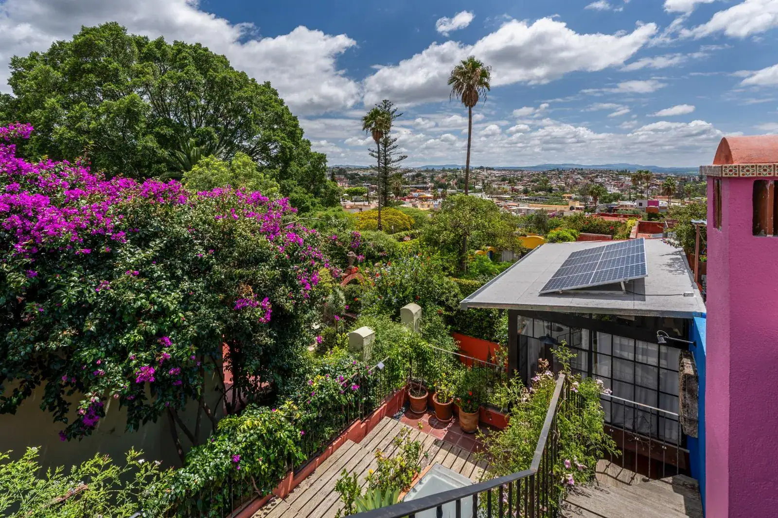Casa Aldama, view over bougainvillea and rooftops from the terrace to the valley, San Miguel de Allende