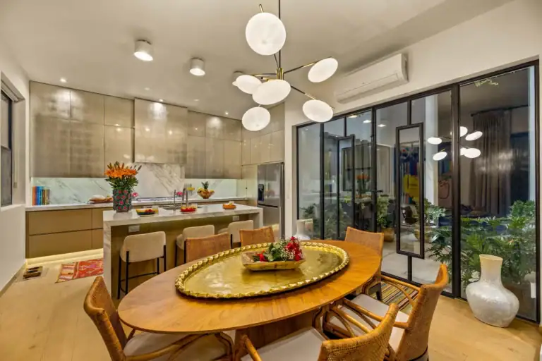 Casa Amoray, dining table with a round brass tray under globe lights, San Miguel de Allende