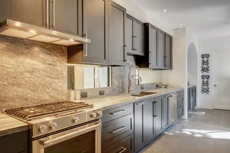 Casa Arcadia, kitchen with gray cabinets and a stone backsplash, San Miguel de Allende