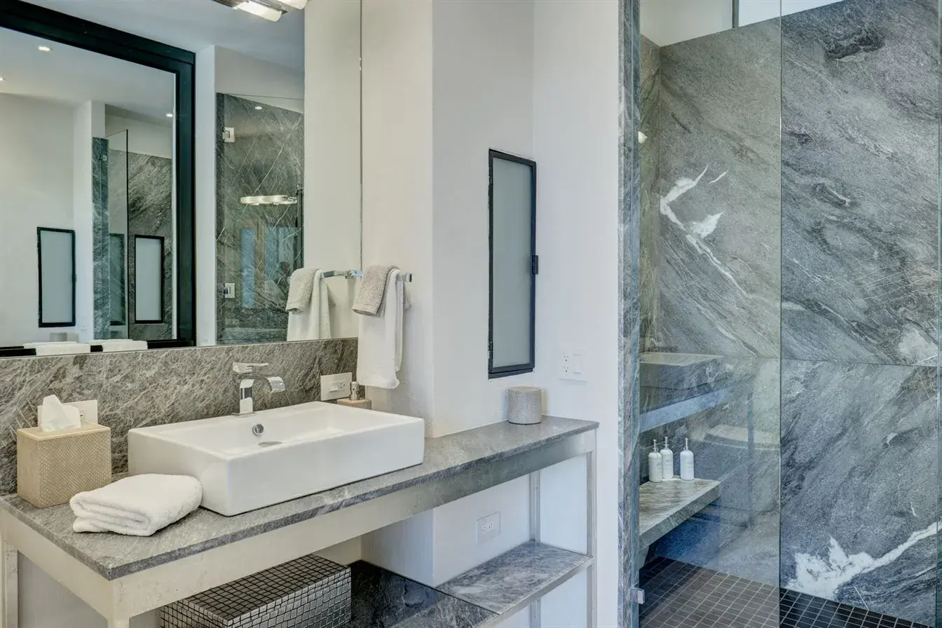 Casa Arcadia, bathroom with a vessel sink and gray marble shower, San Miguel de Allende