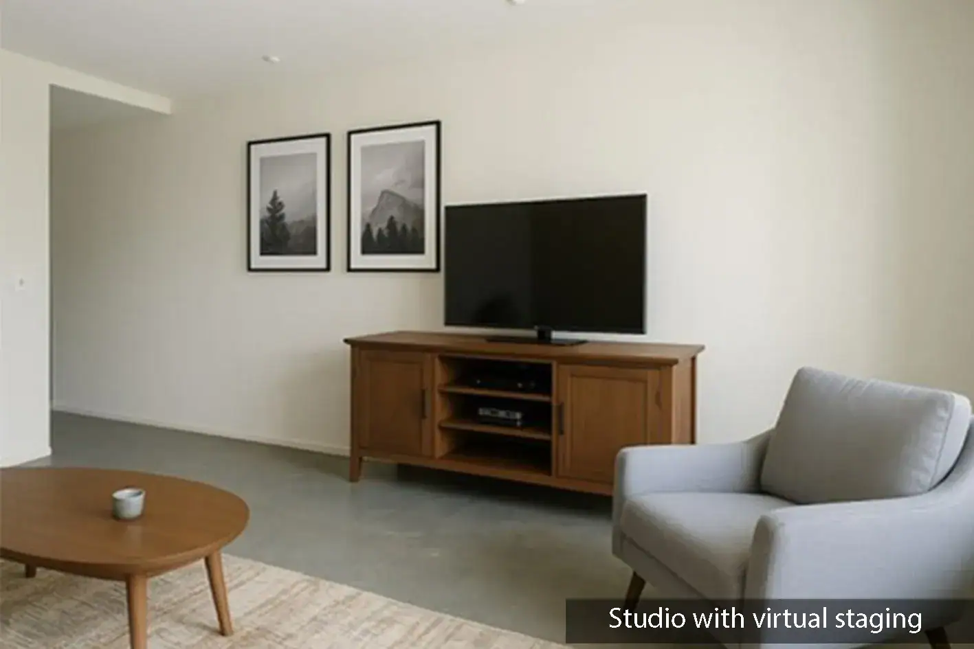 Casa Beatrice, room with a wood television console, a gray armchair and a round coffee table, labeled as virtually staged, San Miguel de Allende