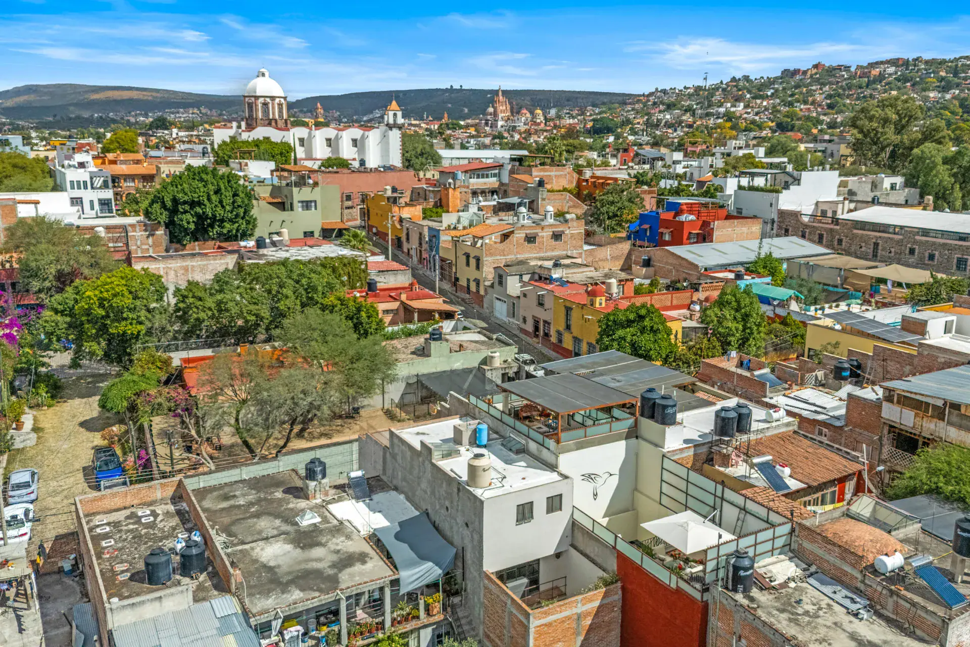 Casa Beatrice, aerial view of the neighborhood with the Parroquia and church domes in the distance, San Miguel de Allende