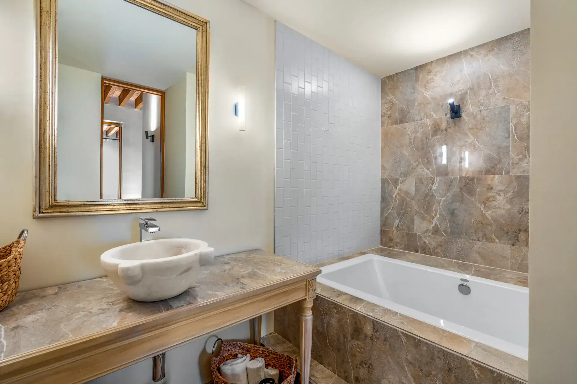 Casa Buenos Tiempos, bathroom with a marble bowl sink, a gold-framed mirror and a soaking tub, San Miguel de Allende