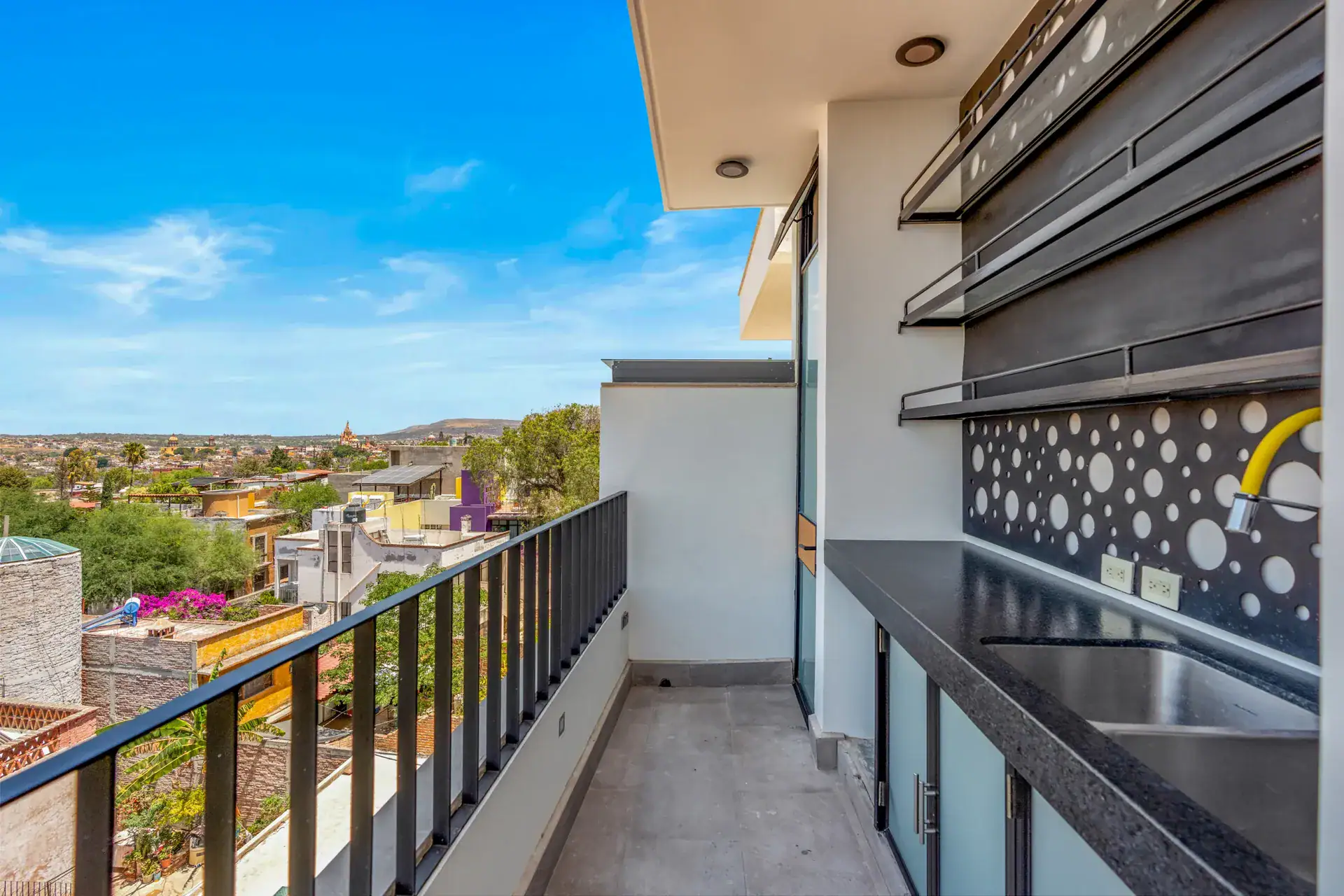 Casa Buenos Tiempos, balcony with a built-in bar counter and a perforated back panel, San Miguel de Allende