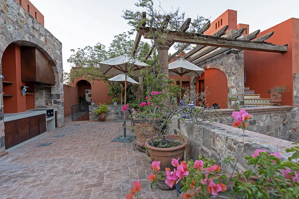 Casa Colonial, brick terrace with a pergola, an outdoor kitchen and bougainvillea, San Miguel de Allende