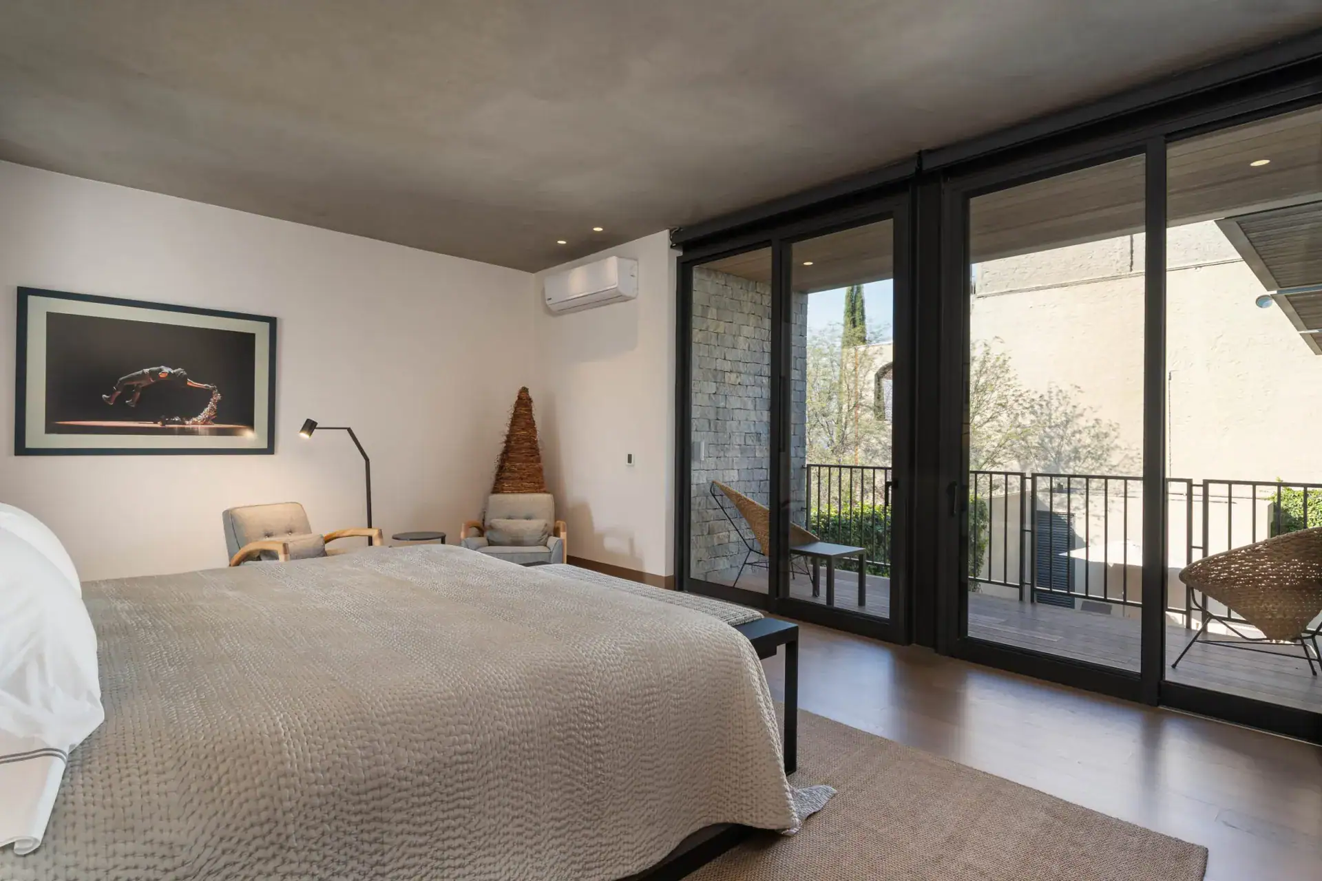Casa Core, bedroom with sliding glass doors opening to a balcony, San Miguel de Allende