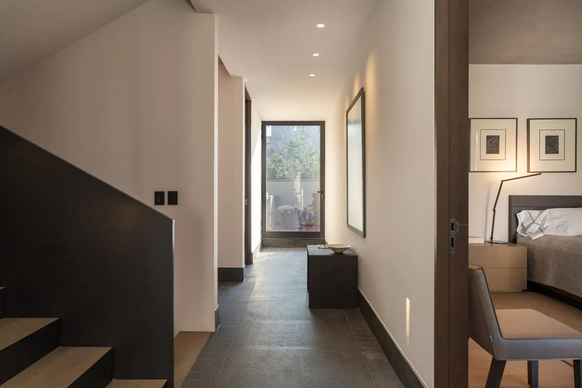 Casa Core, upstairs hallway with a black stair rail leading to the bedroom, San Miguel de Allende