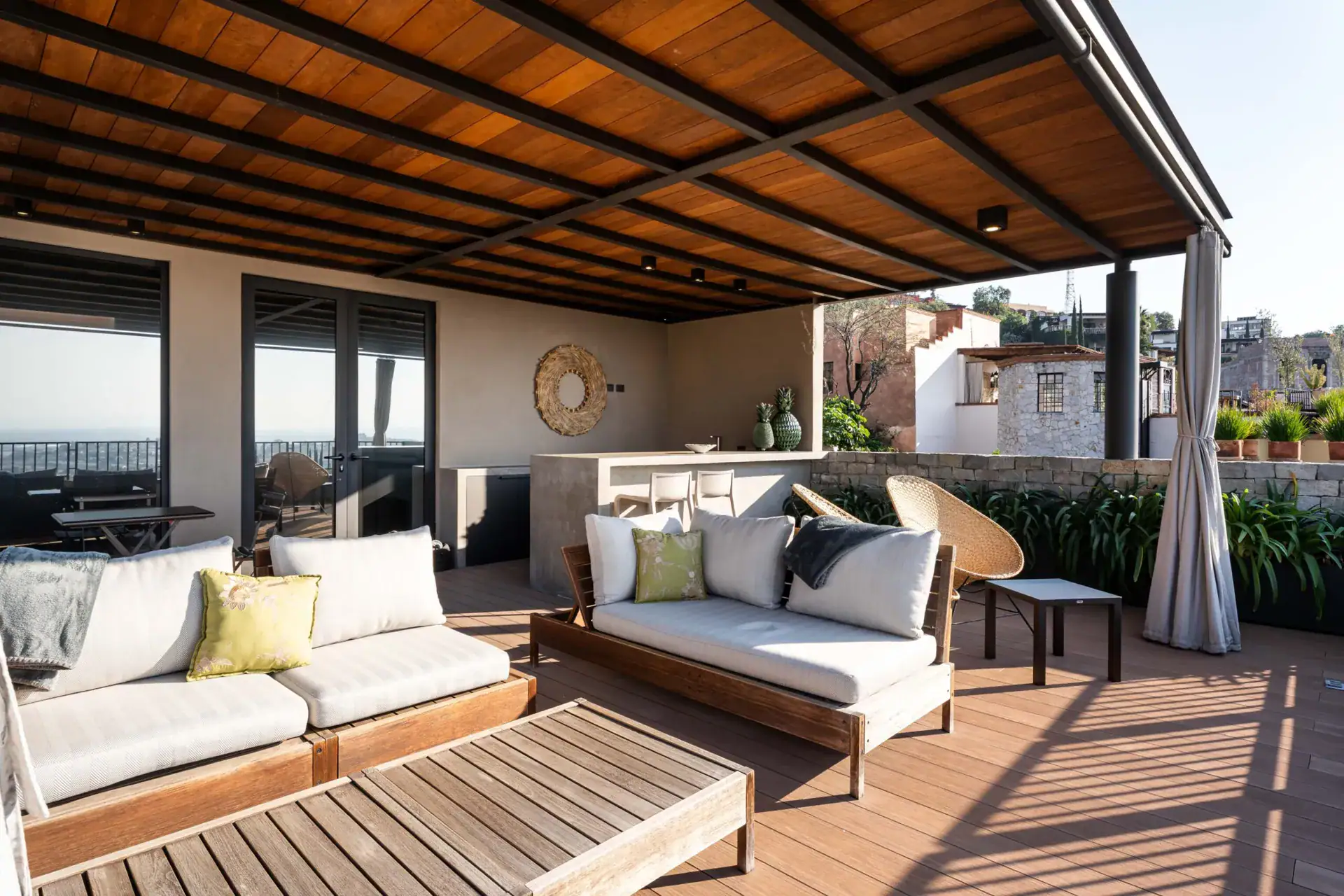 Casa Core, covered rooftop terrace with a wood ceiling, outdoor sofas and views over the town, San Miguel de Allende
