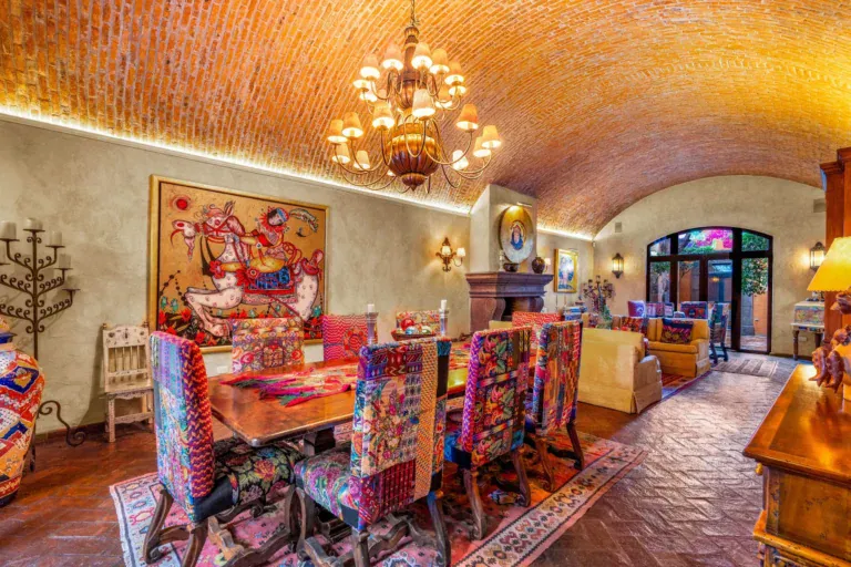 Casa de la Suerte, dining room with brightly upholstered chairs and a brick vaulted ceiling, San Miguel de Allende