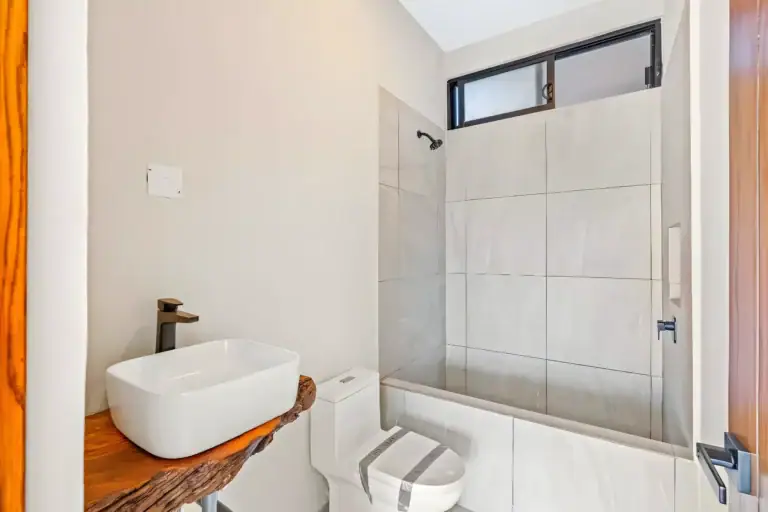 Casa de la Vista, bathroom with a live-edge wood counter, a vessel sink and a tiled shower, San Miguel de Allende