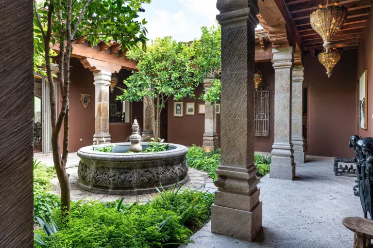 Casa de Salca, central courtyard with a stone fountain and arcades, San Miguel de Allende