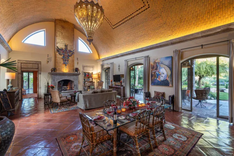 Casa de Salca, great room with a vaulted brick ceiling and a stone fireplace, San Miguel de Allende