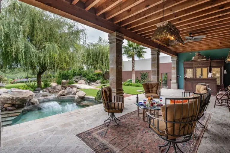 Casa de Salca, covered terrace with wicker chairs beside a plunge pool, San Miguel de Allende